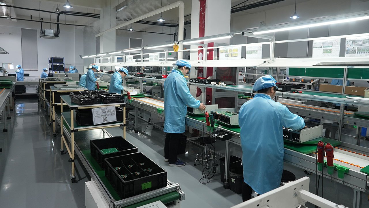 Ikonmac technician assembling internal components of a power quality cabinet