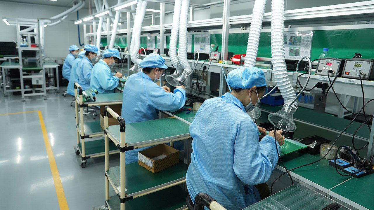 Ikonmac technician performing inductance soldering for power module assembly