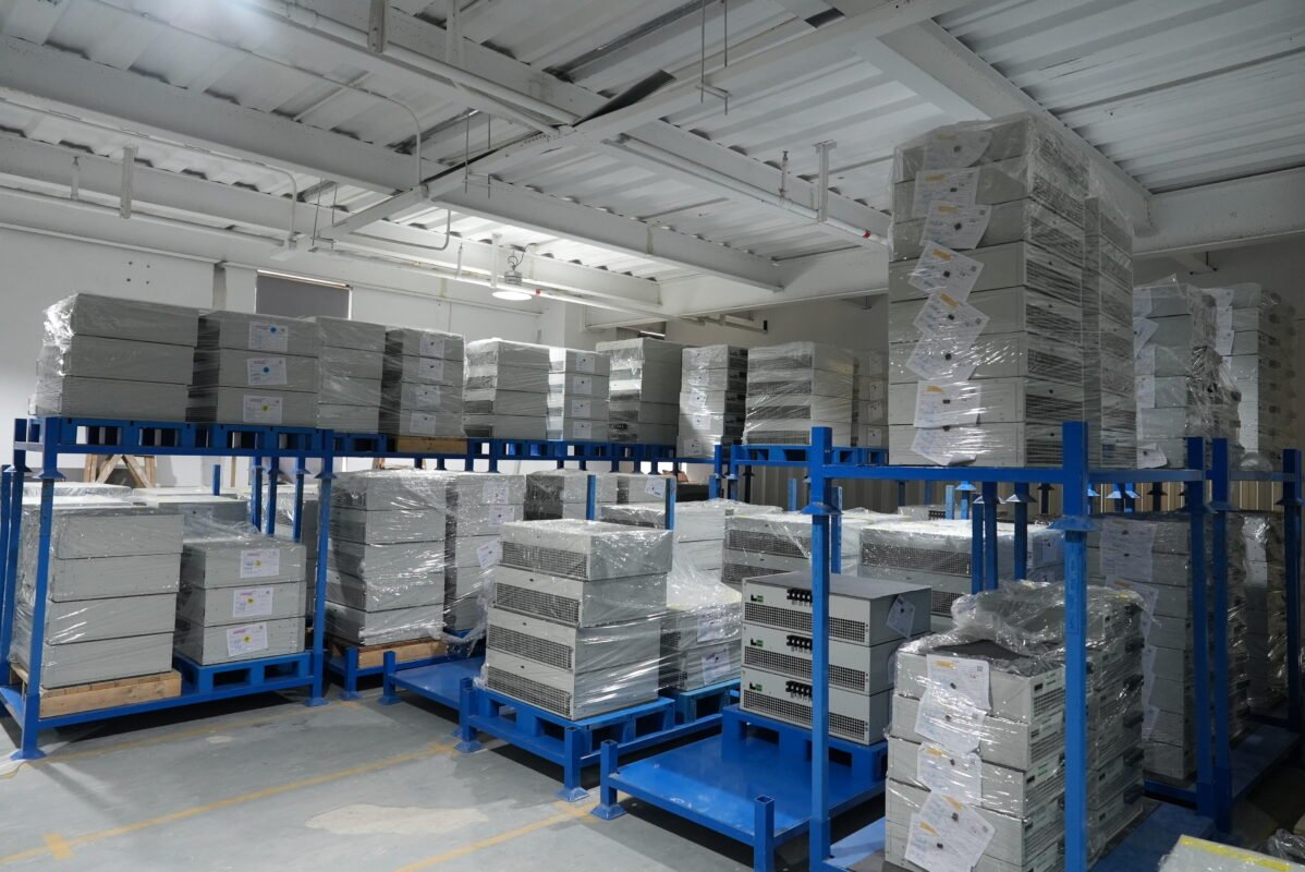 Ikonmac warehouse with stacked Active Harmonic Filter (AHF) and Static Var Generator (SVG) modules ready for shipment